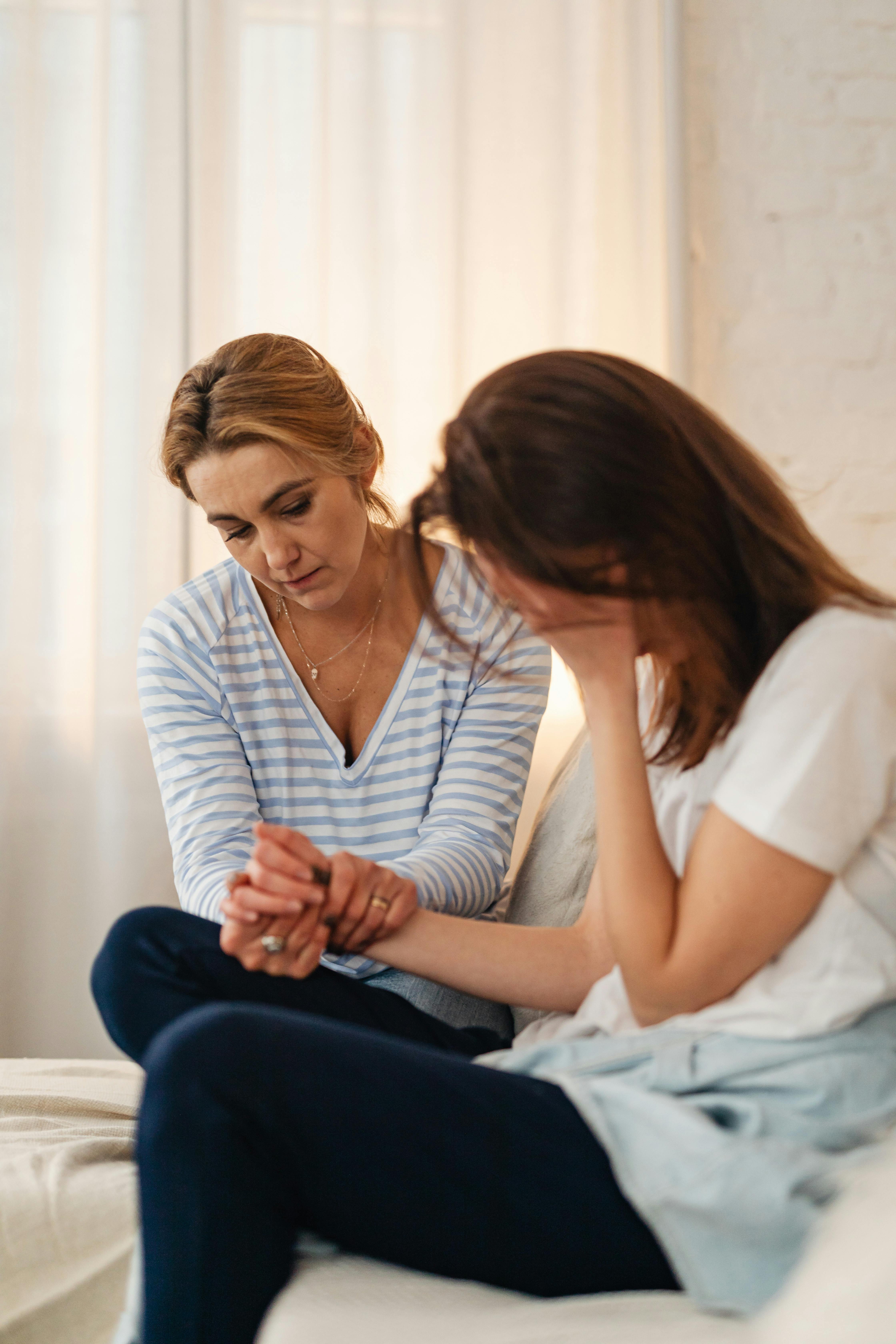 Two women one sad and one emapthic